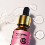 A bottle of Beauty Balance Smoothing Anti Aging by S-SKIN by Snoe balancing a 10% NIACINAMIDE + 1% ZINC PCA SERUM.