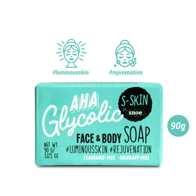 Turquoise packaging of the AHA Glycolic Face and Body Soap by S-SKIN, a Snoe brand, is adorned with text: "90g, 3.17 oz, #luminousskin #rejuvenation, fragrance-free, colorant-free." Illustrations of a sparkling face suggest beauty benefits that flawlessly enhance your make-up routine.