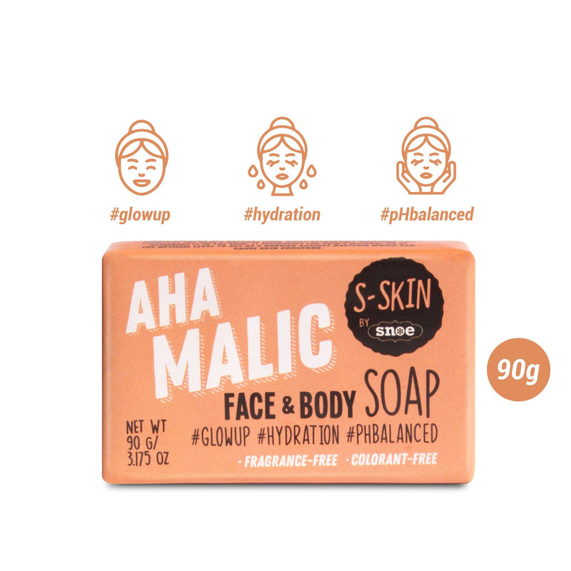 The image features a rectangular orange package of AHA Malic Face and Body Soap by S-SKIN from Snoe. Perfect for beauty enthusiasts, the packaging highlights benefits such as "#Glowup," "#Hydration," and "#pHbalanced," accompanied by icons of faces enjoying skincare. This 90g (3.17 oz) soap is both fragrance-free and colorant-free.
