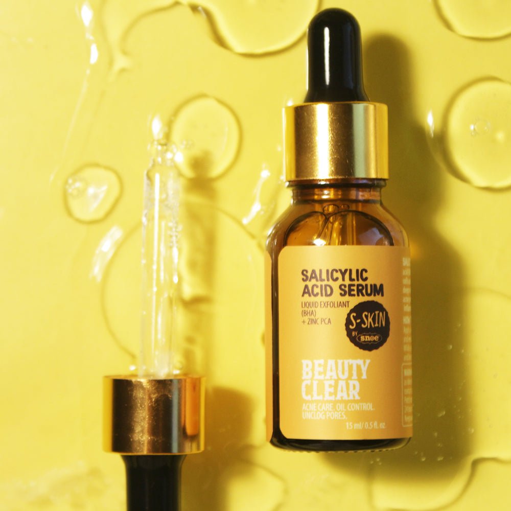 An BHA SALICYLIC ACID + ZINC PCA SERUM | Beauty Clear Acne Care Oil Control 15ml by S-SKIN by Snoe, containing salicylic acid for oil control, displayed on a vibrant yellow background.