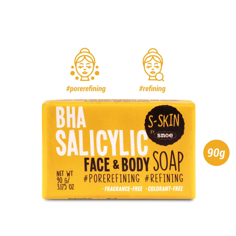 The image depicts a yellow rectangular box containing the BHA SALICYLIC Face and Body Soap by S-SKIN from Snoe. The packaging for this 90g beauty product emphasizes its features such as "pore refining," "fragrance-free," and "colorant-free," alongside icons displaying the text "#porerefining" and "#refining.