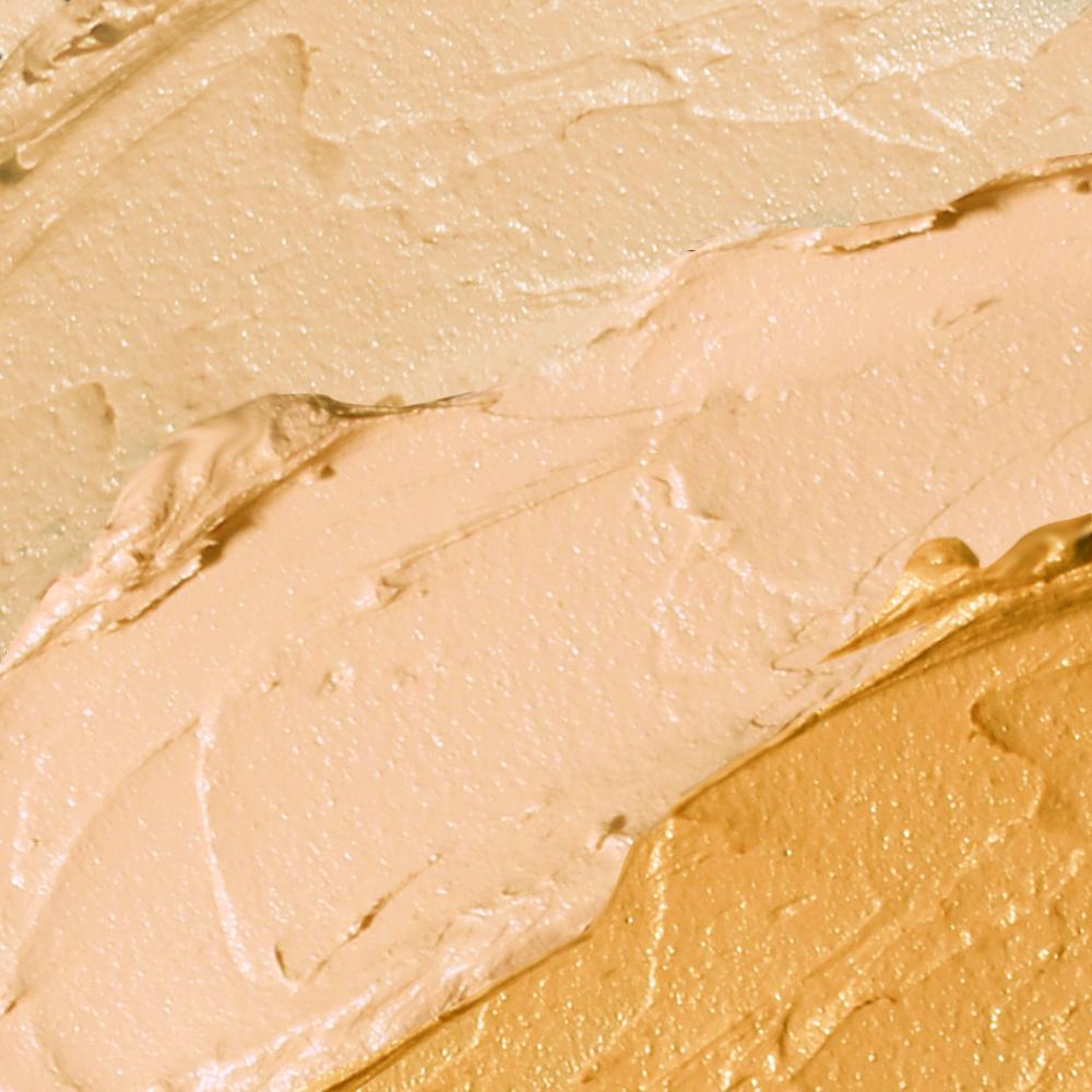 A close up of THE COVER UP's Buildable Concealer in VANILLA CREAM, a gold and beige colored concealer for beauty.