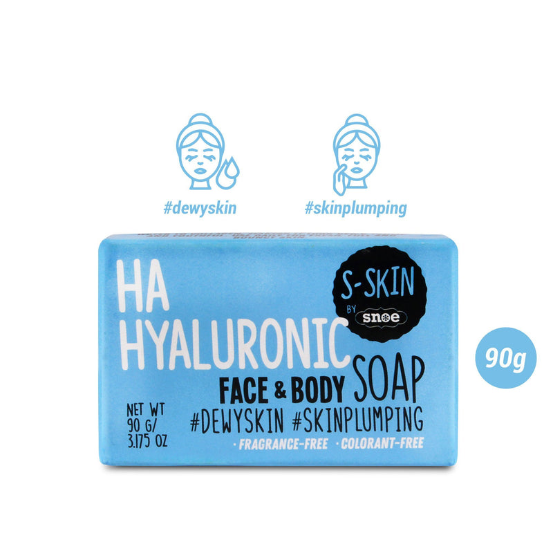 A blue package of "HA Hyaluronic Face and Body Soap" by S-SKIN from Snoe is ideal for beauty enthusiasts. With popular hashtags like #dewyskin and #skinplumping, this 90g (3.17 oz) soap highlights its benefits of being fragrance-free and colorant-free. The packaging features two illustrated faces representing cleansing and skincare symbols.