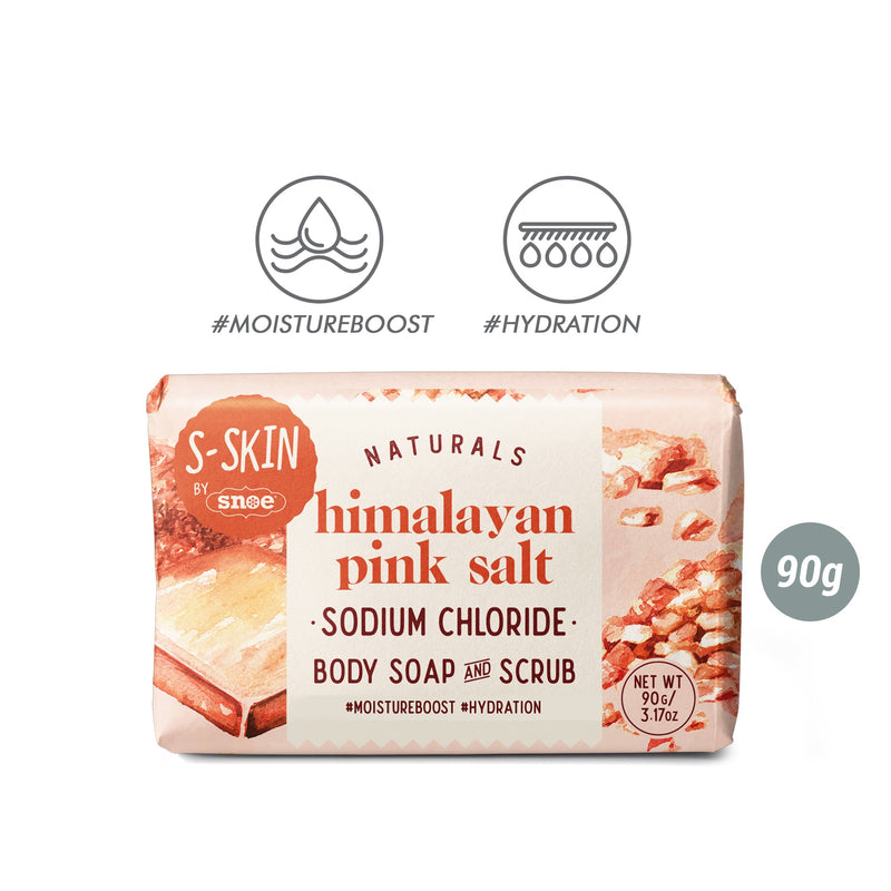 The image shows a package of S-SKIN Naturals' HIMALAYAN PINK SALT: Sodium Chloride Body Soap & Scrub, a beauty must-have. The label lists "sodium chloride" and "90g," with icons emphasizing #MoistureBoost and #Hydration benefits. The packaging features an illustration of pink salt crystals.