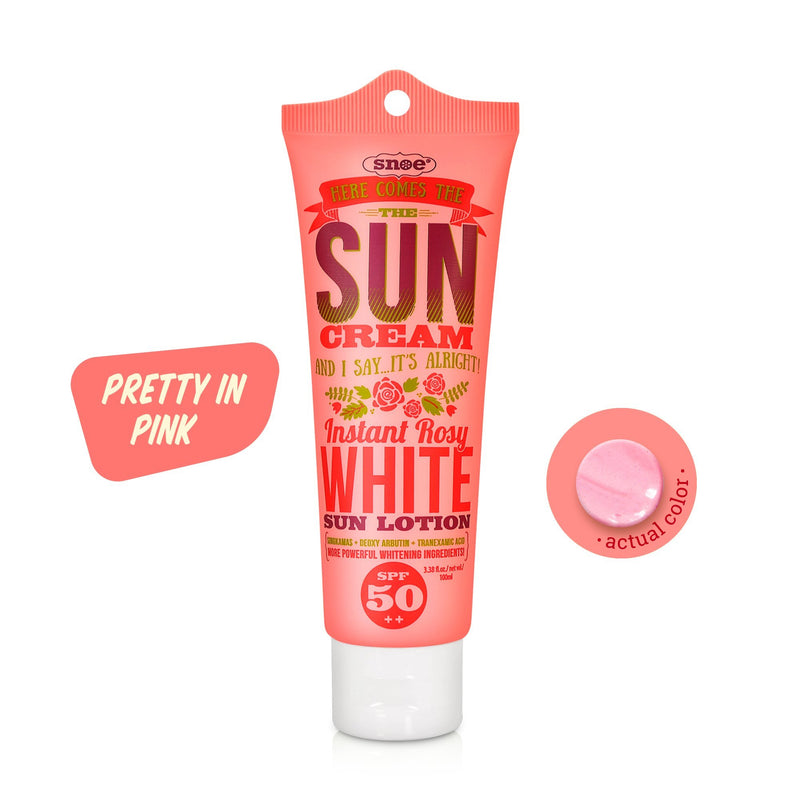 A vibrantly designed tube of sun cream branded as HERE COMES THE SUN CREAM is labeled "Instant Rosy White Sun Face & Body Lotion SPF 50++." Ideal for beauty enthusiasts, the predominantly pink packaging is adorned with red and gold text. A circular swatch displays the actual pink color of the make-up product, accompanied by a text bubble that reads "Pretty in Pink.