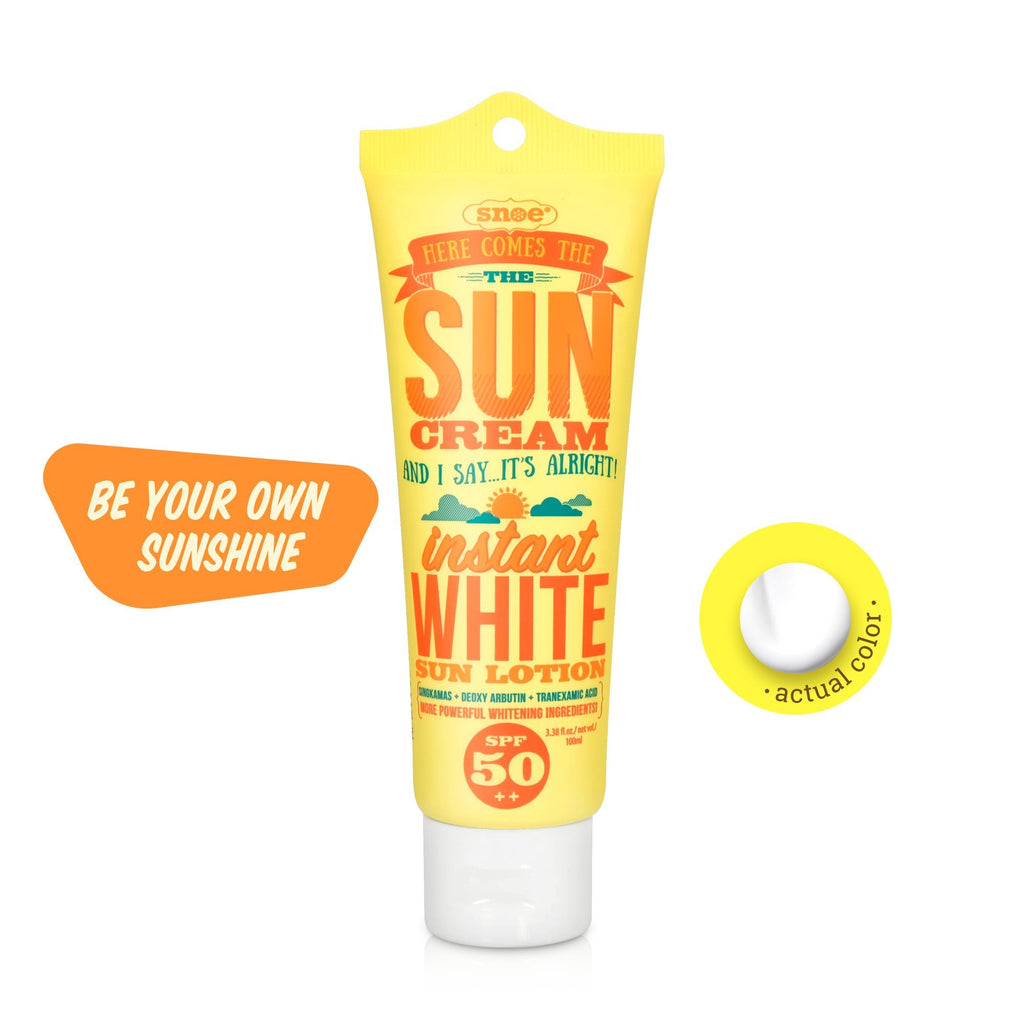 A tube of HERE COMES THE SUN CREAM Instant White Sun Face & Body Lotion SPF 50++ for skincare protection.
