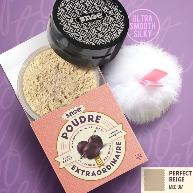 The image showcases an open container of Poudre Extraordinaire Loose Powder SPF 30+ in PERFECT BEIGE, with the lid placed beside it. A fluffy white powder puff is positioned next to the make-up container. The packaging is light pink adorned with geometric designs and labeled "Poudre Extraordinaire." The background features a purple hue with text reading "Ultra Smooth Silky.