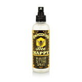 A bottle of DON'T WORRY BEE HAPPY Makeup Setting Spray on a white background that enhances hair and skincare.
