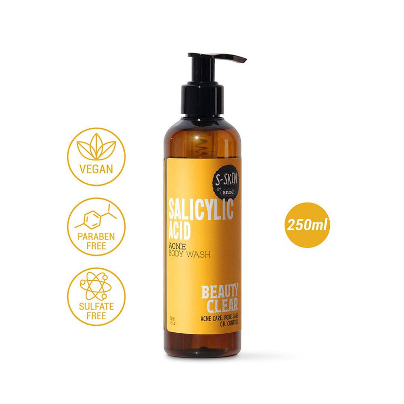 A 250ml amber bottle of SALICYLIC ACID ACNE BODY WASH from S-SKIN by Snoe comes with a black pump dispenser. Highlighted with gold icons that specify it as "Vegan," "Paraben Free," and "Sulfate Free," it is branded as "Beauty Clear" and designed for "Oil Control," making it ideal for maintaining a clear complexion underneath your make-up.